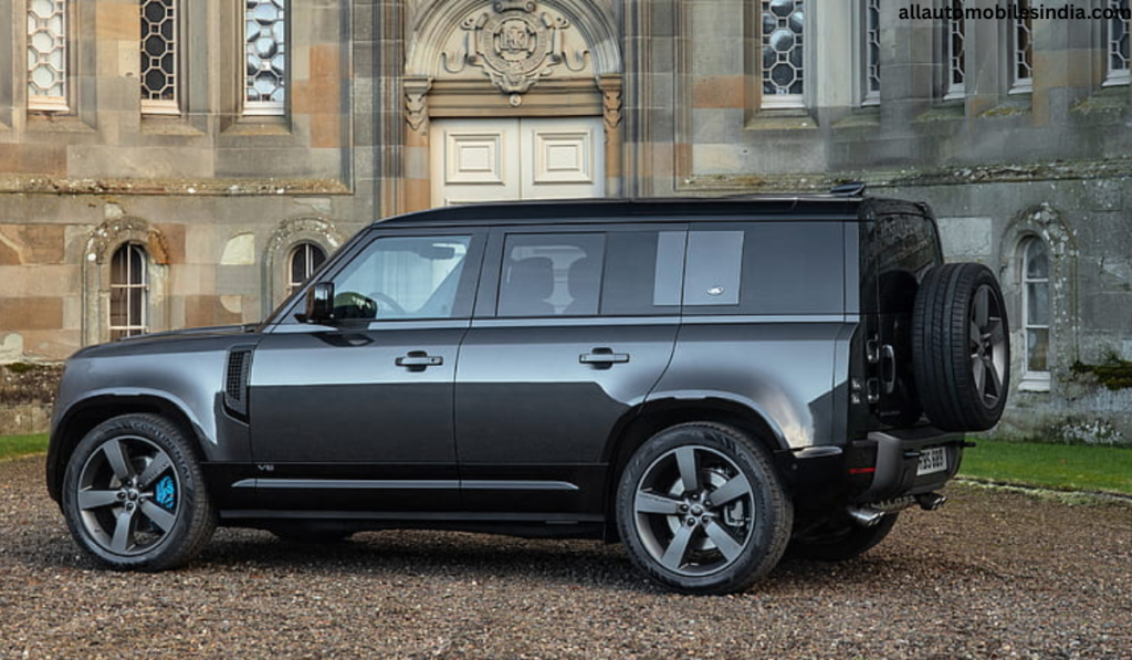 Land Rover Defender off-road SUV driving through rugged terrain